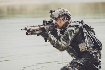 Portrait of a ranger in the battlefield with a gun