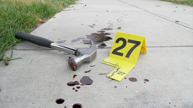 HAMMER, USED AS A WEAPON, LEFT AT A CRIME SCENE