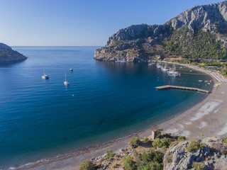 Bending a pebble beach. Resort area in the Bay on the Mediterranean coast of Turkey