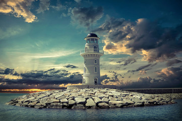 Lighthouse on the sea under sky
