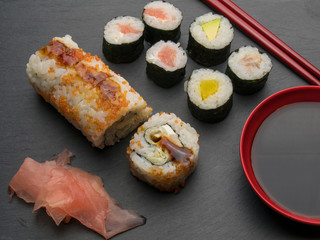 Sushi roll with salmon cucumber avocado red caviar. Sushi menu. Japanese food.