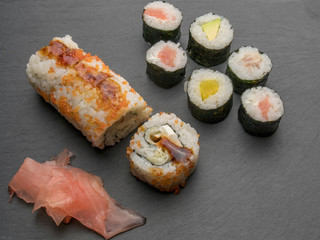 Sushi roll with salmon cucumber avocado red caviar. Sushi menu. Japanese food.