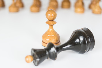 Simple old chess pieces - pawn and fallen queen