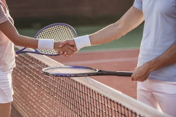 Deurstickers Couple playing tennis © georgerudy