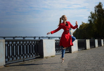 beautiful ballerina dance in city and read the book. inspiration concept. woman in headphones...