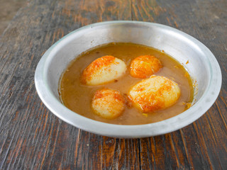 Fried Boiled Egg with Tamarind Sauce, Thai food called 