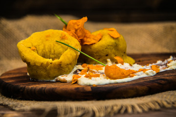 Detail on special designe for food on a wooden board.