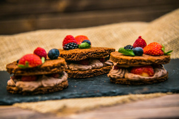 cookies decorated with fresh fruits.Detail on special designe for food on plate