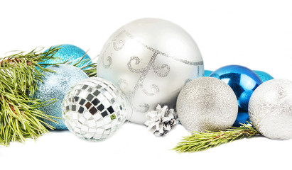 Fototapeta na wymiar New year and Christmas composition with fir tree branch, beautiful silver ball and blue balls