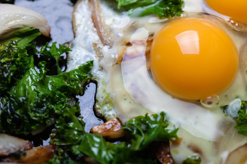Fried eggs with vegetables.