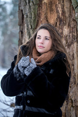 Woman in a black fur coat