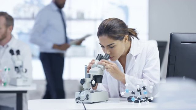  Medical research team in the lab, working on computers & analyzing samples