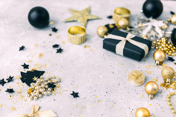 Christmas background with gold decorations  with copy space over grey desk