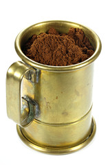 vintage German brass coffee measuring cup isolated on white background