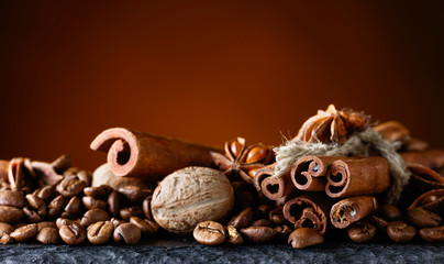 Roasted coffee beans with spices .