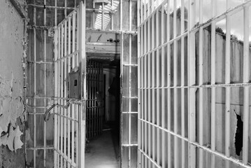 Open metal barred gates inside an old prison