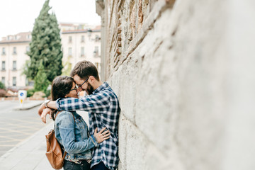 .A young couple in love walking around Madrid and enjoying a very fun day of sightseeing around the city center. Travel photography. Lifestyle