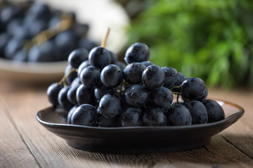 Dark grape in bowl.