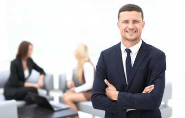 successful businessman on blurred background office