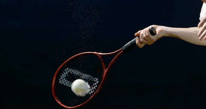  Close up in super slowmo, tennis ball suspended in mid air before being hit