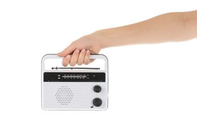 Woman holding radio on white background