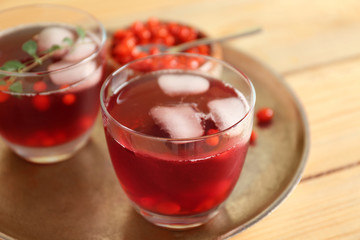 Glasses with goji juice on metal tray