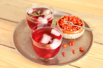 Glasses with goji juice on metal tray