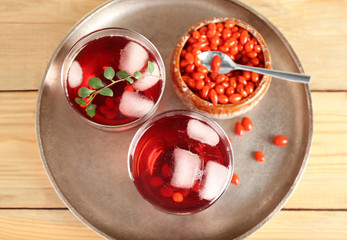 Glasses with goji juice on metal tray