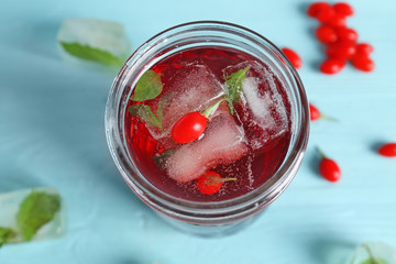 Jar with goji juice on table