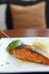 Baked salmon , salmon steak with potatoes on white wine sauce
