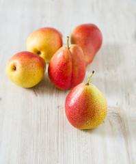 beautiful ripe pears on wooden surface