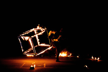 fire-show with a burning cube