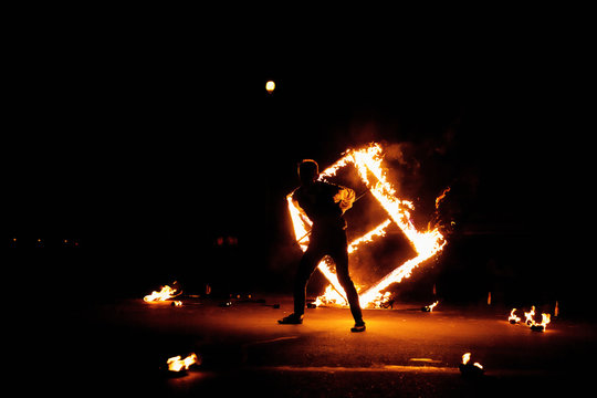 fire-show with a burning cube