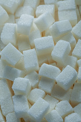 White sugar cubes food concept vertical view