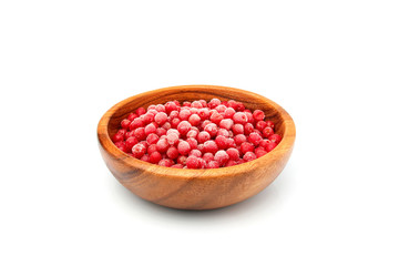 Frozen red sea-buckthorn berries in a wooden bowl.