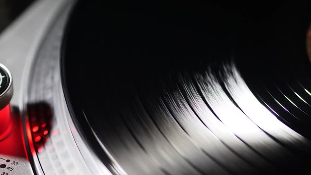 Spinning Record Player With Vintage Vinyl.