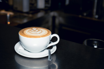 Latte macchiato on table