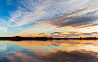 Fototapeta premium Sunset. Beautiful Sunset reflection in water