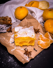 piece of tangerine cake on brown kraft paper