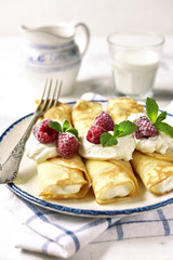 Crepes stuffed with ricotta.