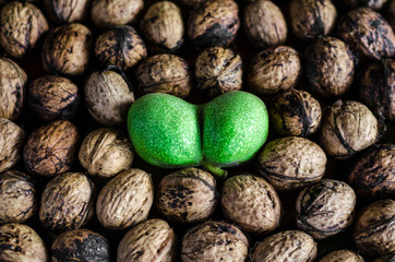 a lot of textured peeled walnuts and one double green