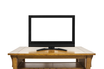 Flat screen television with cut out screen on large table isolated on white.  