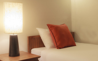 Bedroom with pillow and lamp.