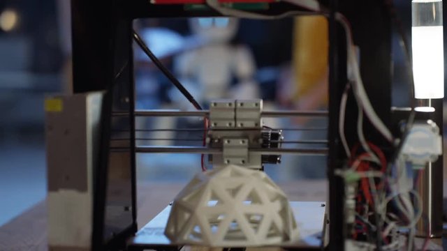 Electronics engineering team building robot with 3D printed components