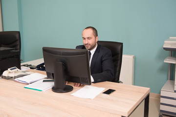 Businessman On A Break With His Computer