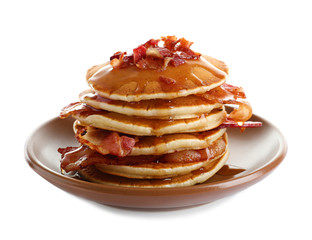 Plate with pancakes and bacon on white background