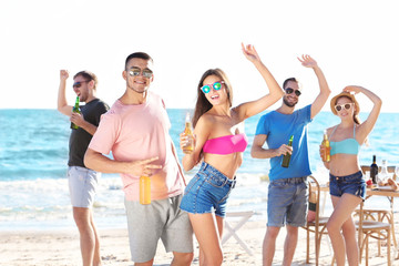Fototapeta premium Young people having party on beach