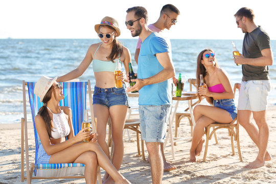 Young people having party on beach