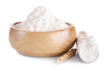 Bowl and scoop with flour on white background