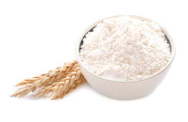 Bowl with flour on white background